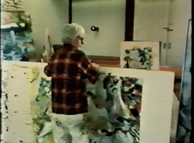 Willem de Kooning carrying the present work in his studio, c. 1977.